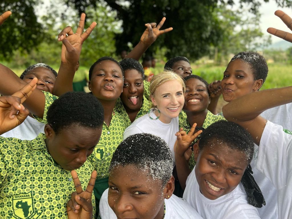 Abroad student standing in the middle of foreign students