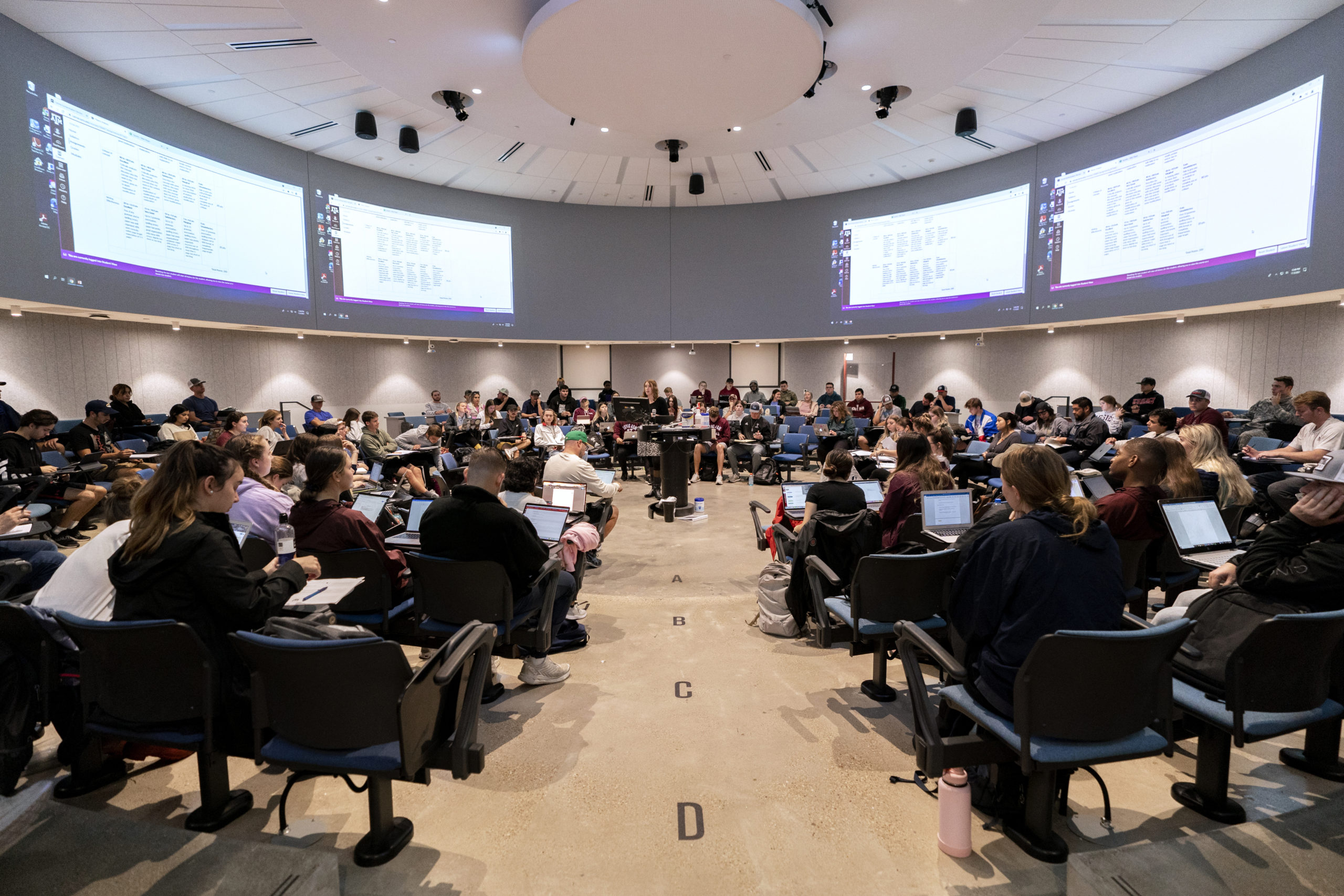 Students sitting in a circular classroom