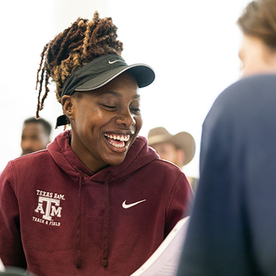 Student laughing in a classroom